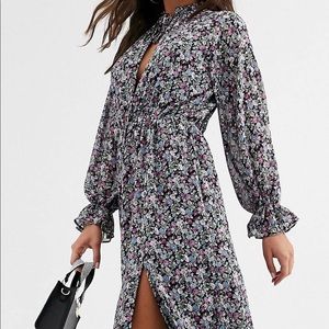 Tie neck ruffle midi dress in floral print.